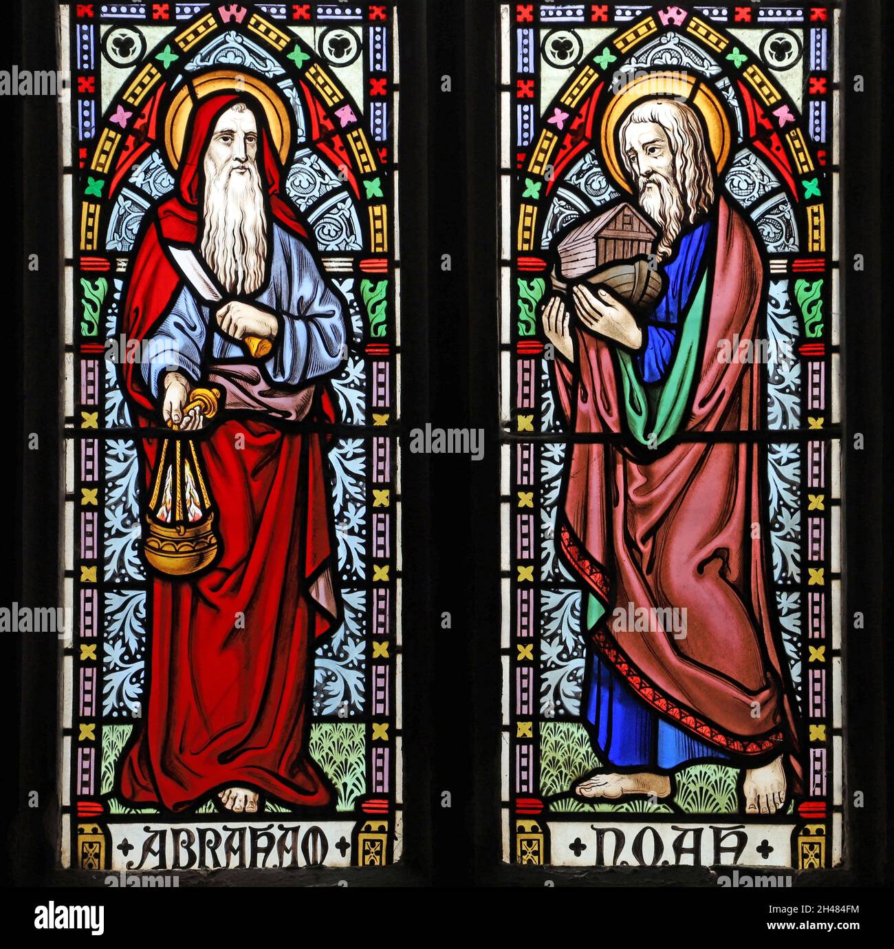 A stained glass window by Michael O'Connor depicting Abraham and Noah, St Michael & All Angels Church, Fringford, Oxfordshire Stock Photo