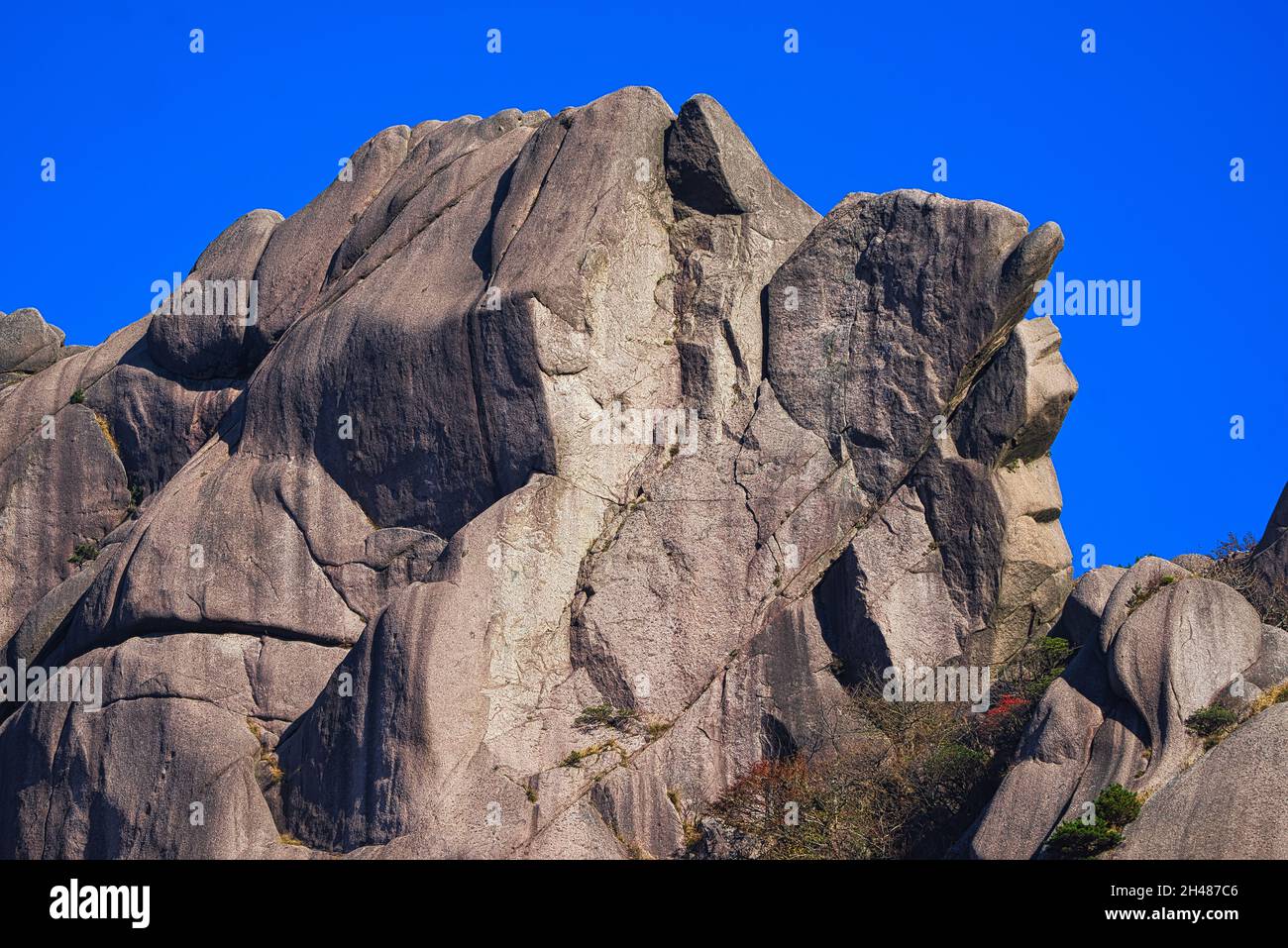 Huge and simply textured granite hill. Landscape of Mount Huangshan (Yellow Mountain). UNESCO World Heritage Site. Anhui Province, China. Stock Photo