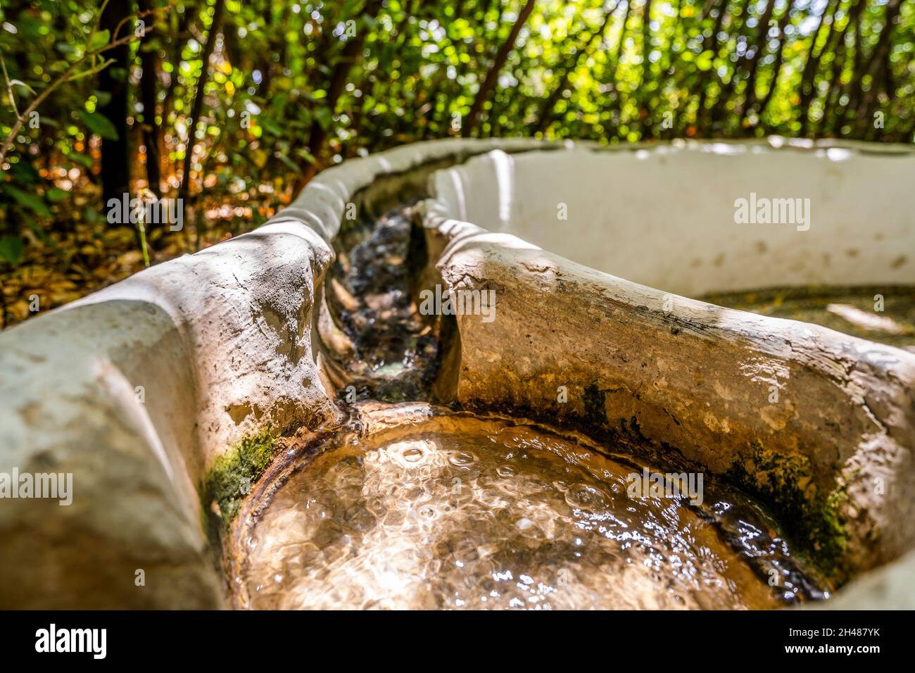 Water flowing in the handrail in Generalife garden in palace complex called Alhambra in Granada, Spain Stock Photo