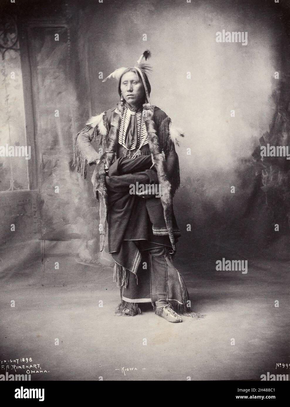 An American of the Kiowa tribe. Platinum print by F.A. Rinehart, 1898. Stock Photo