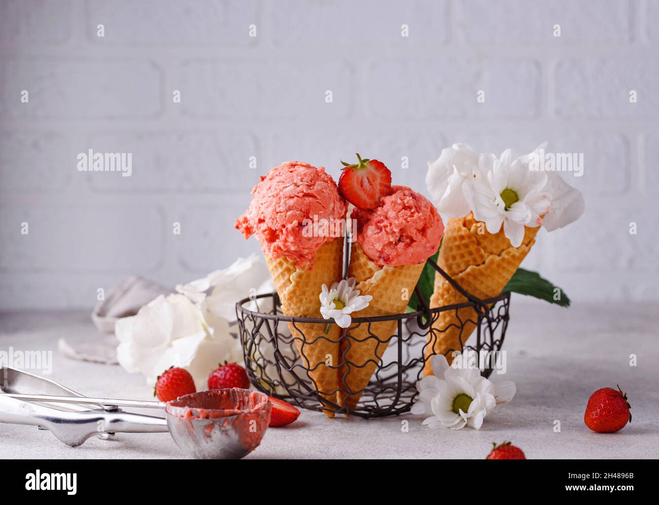 Strawberry ice cream in waffle cone Stock Photo - Alamy