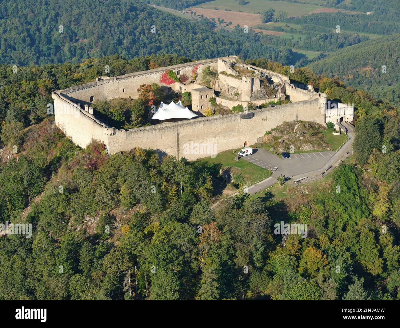 AERIAL VIEW. Medieval castle on a hilltop in the eastern Vosges Mountains. Hohlandsbourg Castle, Wintzenheim, Haut-Rhin, Alsace, Grand Est, France. Stock Photo