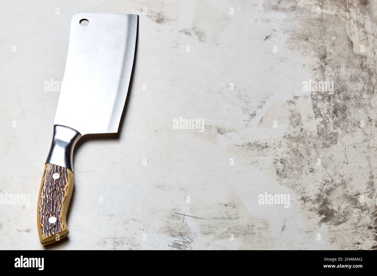 Meat cleaver on wooden background. Stainless steel Kitchen knife or Butcher cleaver on a wood