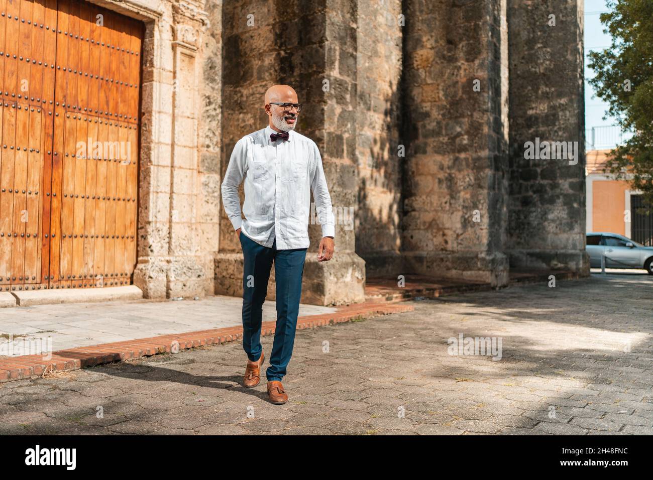 Handsome bald hispanic man hi-res stock photography and images - Alamy