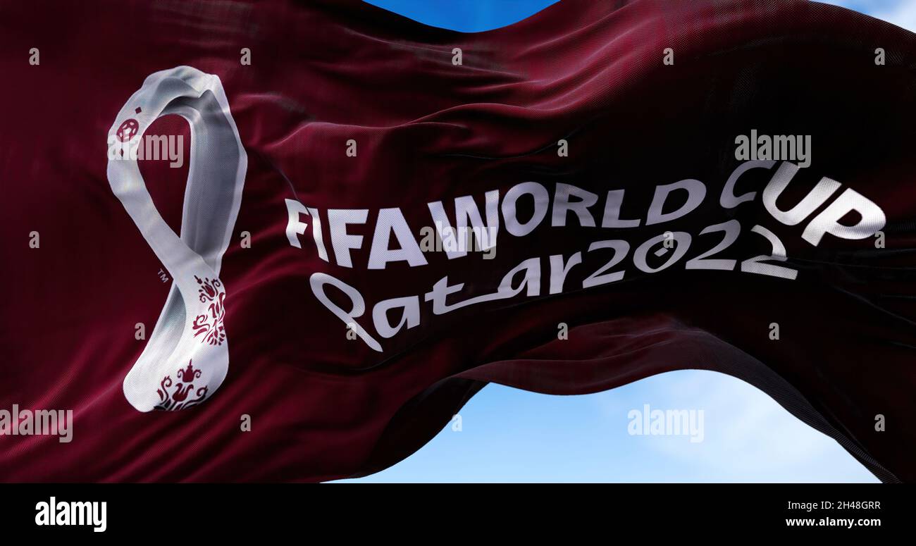 Doha, Qatar, October 2021: A flag with the 2022 Fifa World Cup logo flapping in the wind. The event is scheduled in Qatar from 21 November to 18 Decem Stock Photo