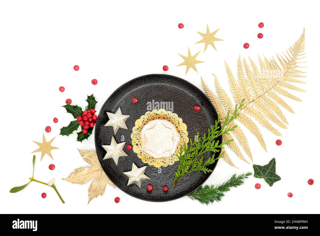 Luxury Christmas mince pie treat on plate with gold leaf, star tree ...