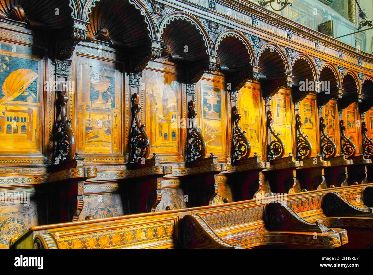 Choir stalls in Cathedral of San Lorenzo in Alba, Piedmonte Region, Italy. The cathedral is located in the eastern sector of the ancient city of Alba Stock Photo