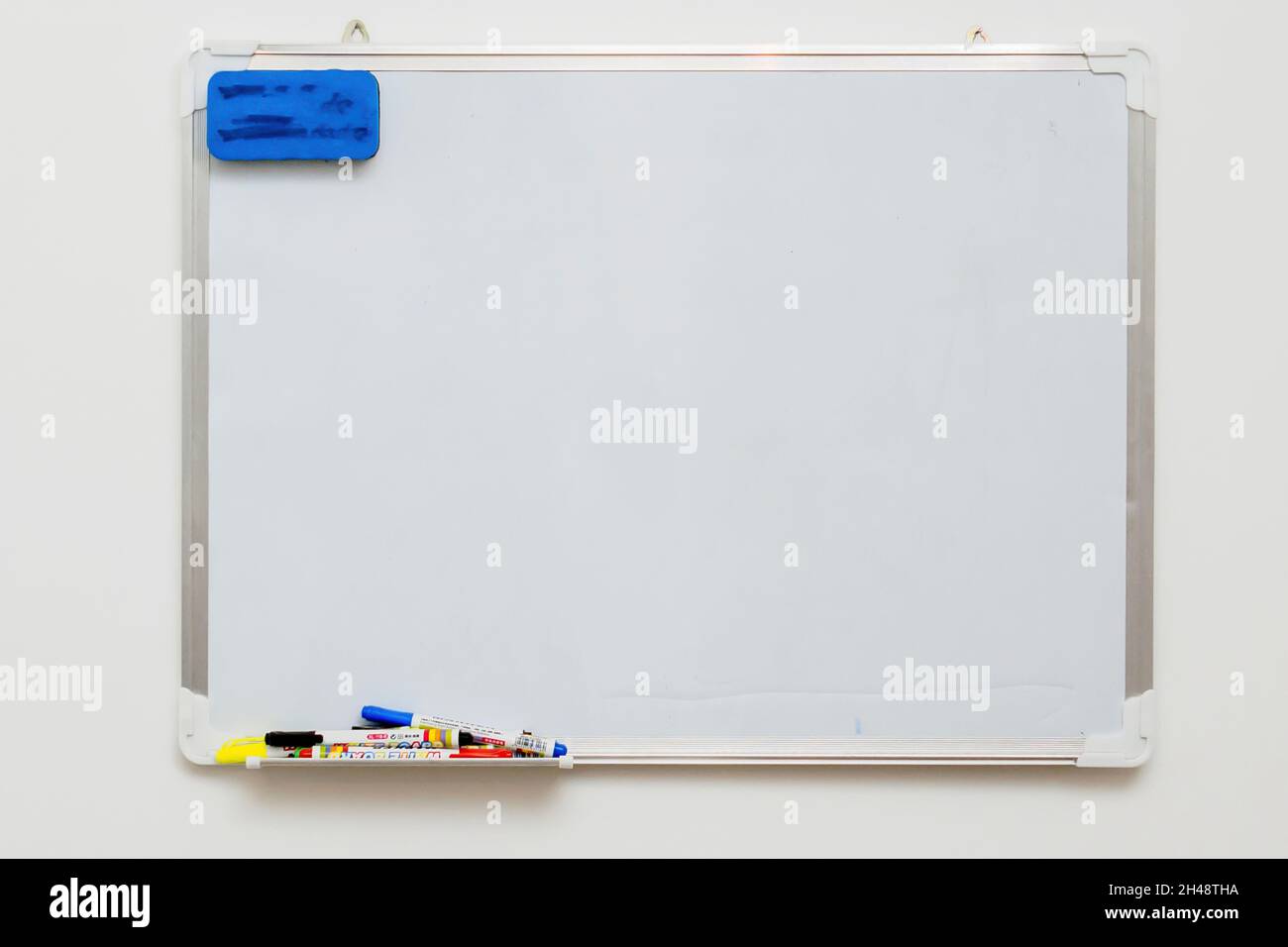 Blank Dry Erase White Board, colour marker pens and eraser Stock Photo