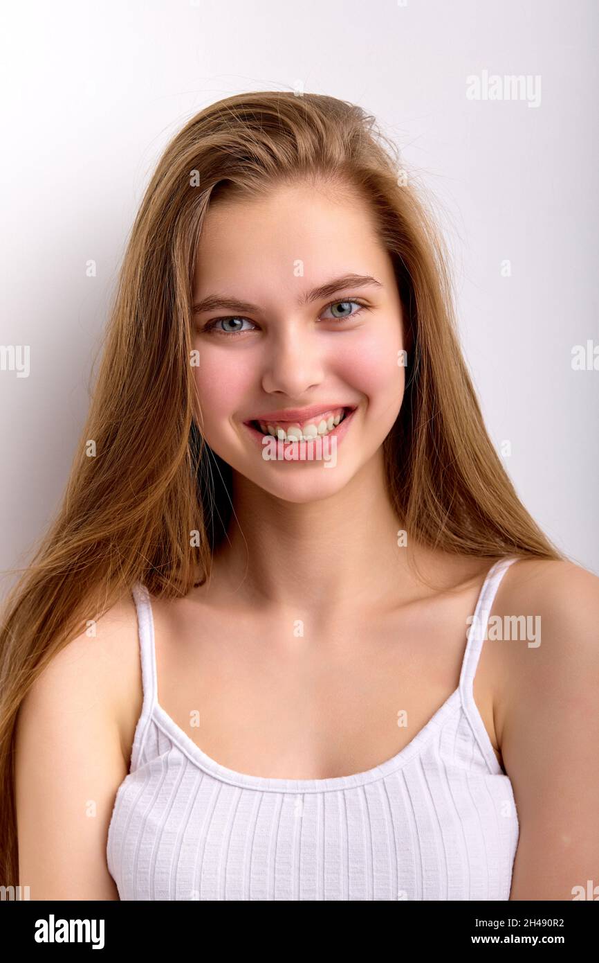 Close-up portrait of cheerful caucasian female with long natural hair ...