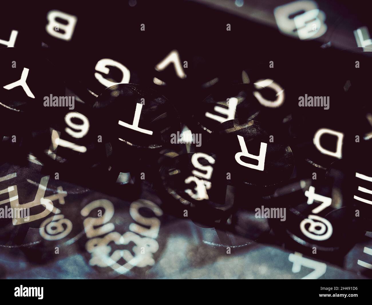 Montage of a Typewriter keyboard with overlapping images in a cross processed tone Stock Photo