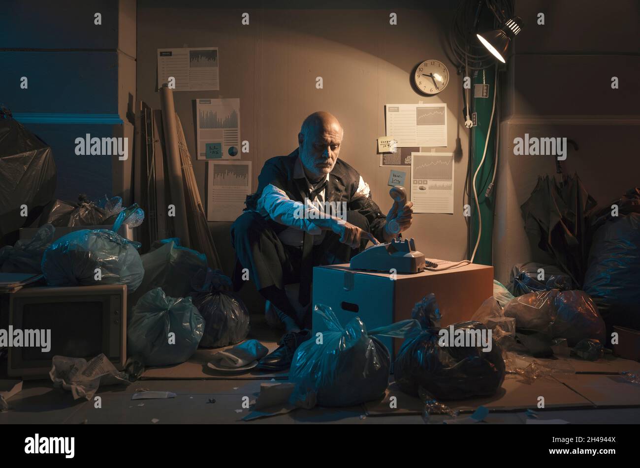 homeless-broke-businessman-sitting-on-the-street-he-is-staring-at-the