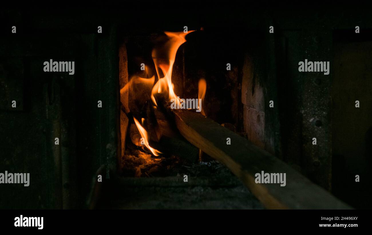 Fire inside a Fire place Stock Photo