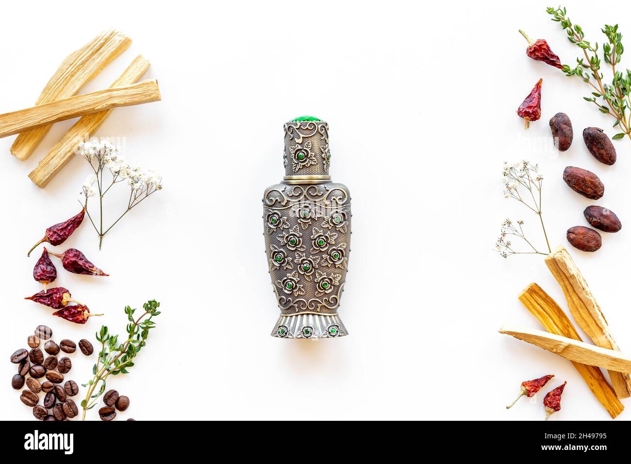 Arabian oud oil perfume with ingredients spices and fruits Stock Photo