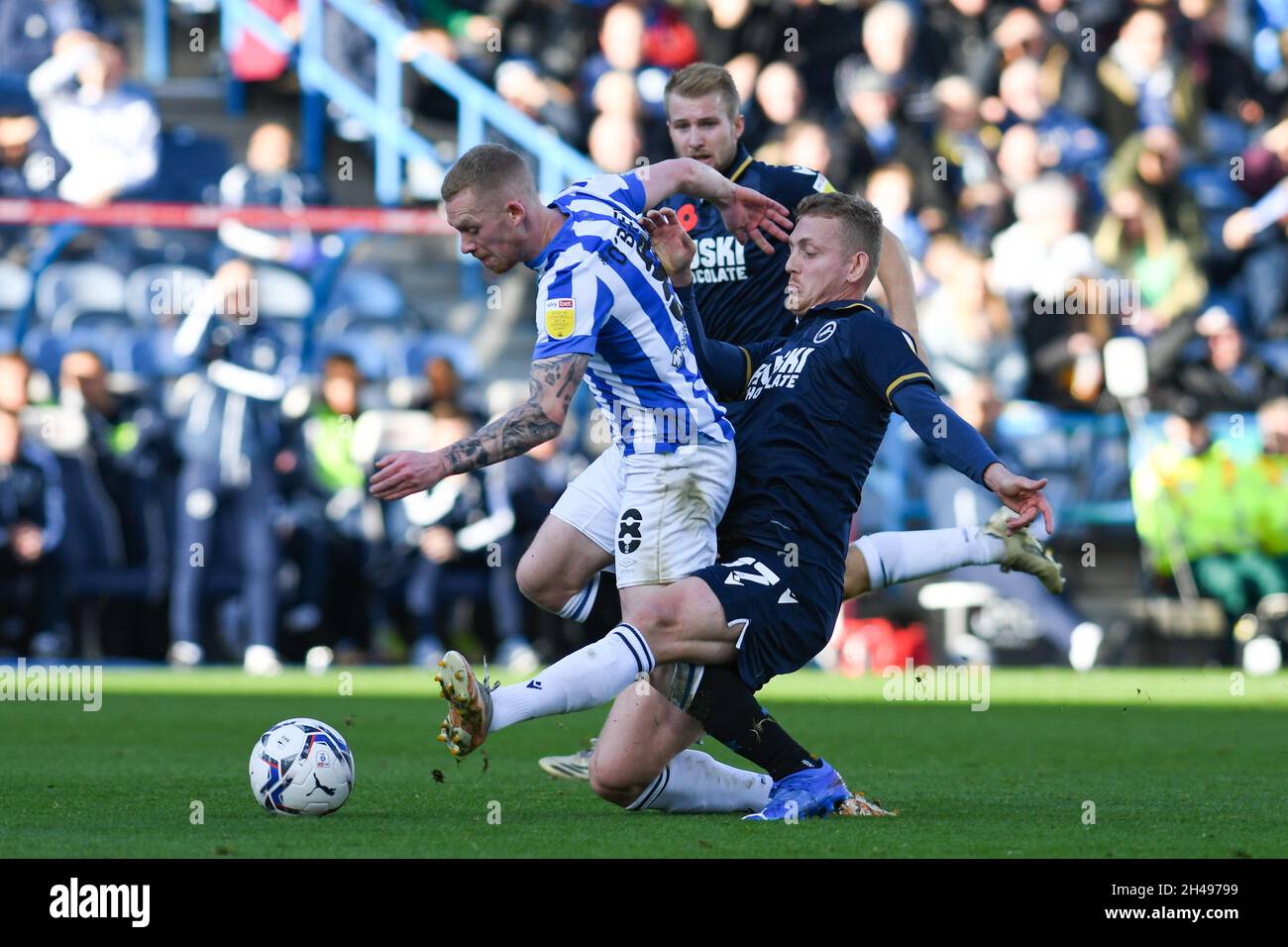 Huddersfield's Lewis O'Brien is hacked down by Millwall's Saville.Picture Liam Ford
