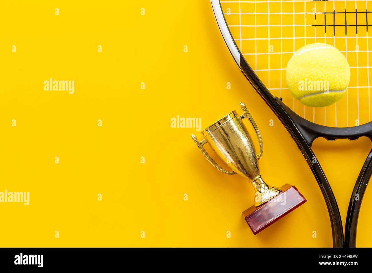 Tennis champion award - small golden trophy cup with tennis racket and ball  Stock Photo - Alamy