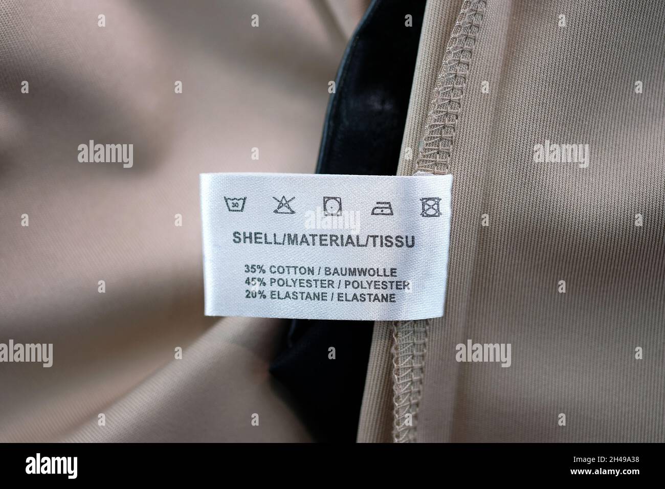 Garment label on the dress with washing care instructions. Label for