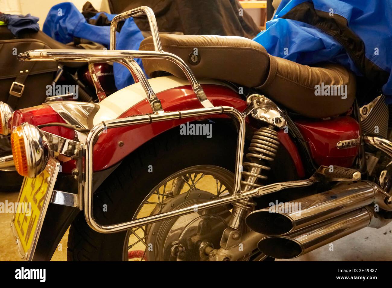 Grainy image showing the cracked and broken mounting bracket on a luggage rack fitted to a Yamaha Virago 535 Stock Photo