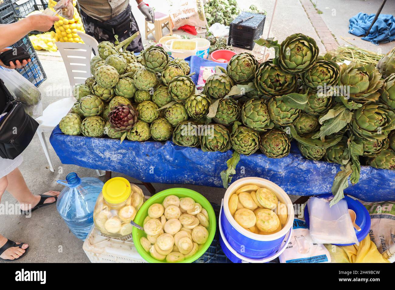 Fresh organic green artichoke vegetables at the village bazaar market. Stock Photo