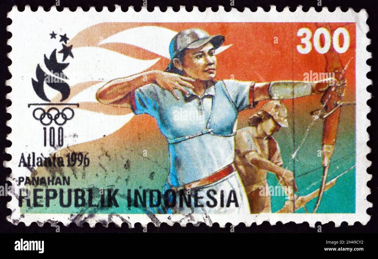 INDONESIA - CIRCA 1996: a stamp printed in Indonesia shows archery, is the sport of using a bow to shoot arrows, 1996 Summer Olympics, Atlanta, circa Stock Photo