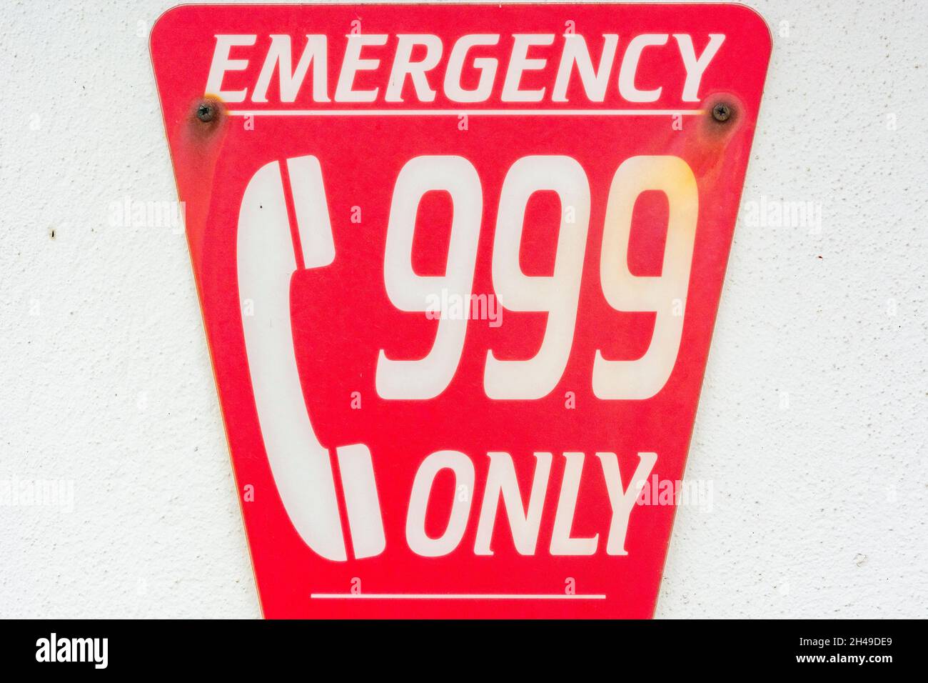 Lifeguard Phone Emergency help phone sign on wall of a static lifeguard shelter on a ...