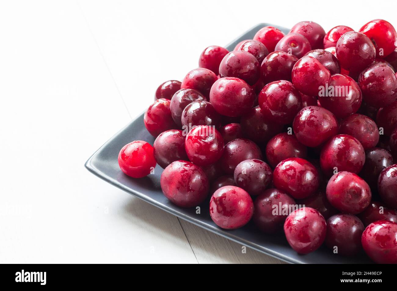 fresh cherry fruits on plate Stock Photo