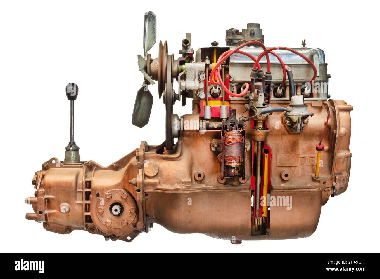 Side view of a disassembled vintage car engine with transmission and gear shift isolated on a white background Stock Photo