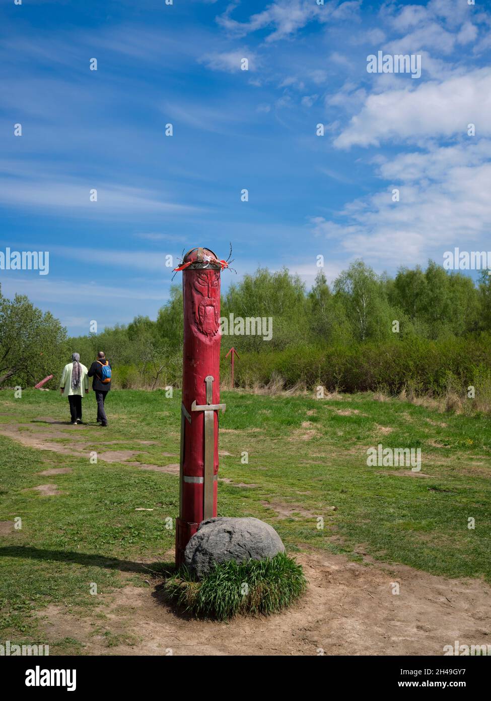Slavic pagan idol with a stone altar standing near contemporary pagan temple in Bitsevski Park (Bitsa Park). Moscow, Russia. Stock Photo