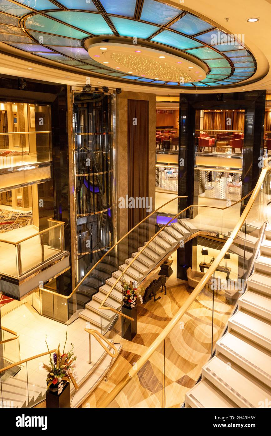 Southampton, UK - 30th September 2021: The luxury P and O cruise ship Ventura. Interior shot of the glass atrium and stairwyays in the centre or the s Stock Photo