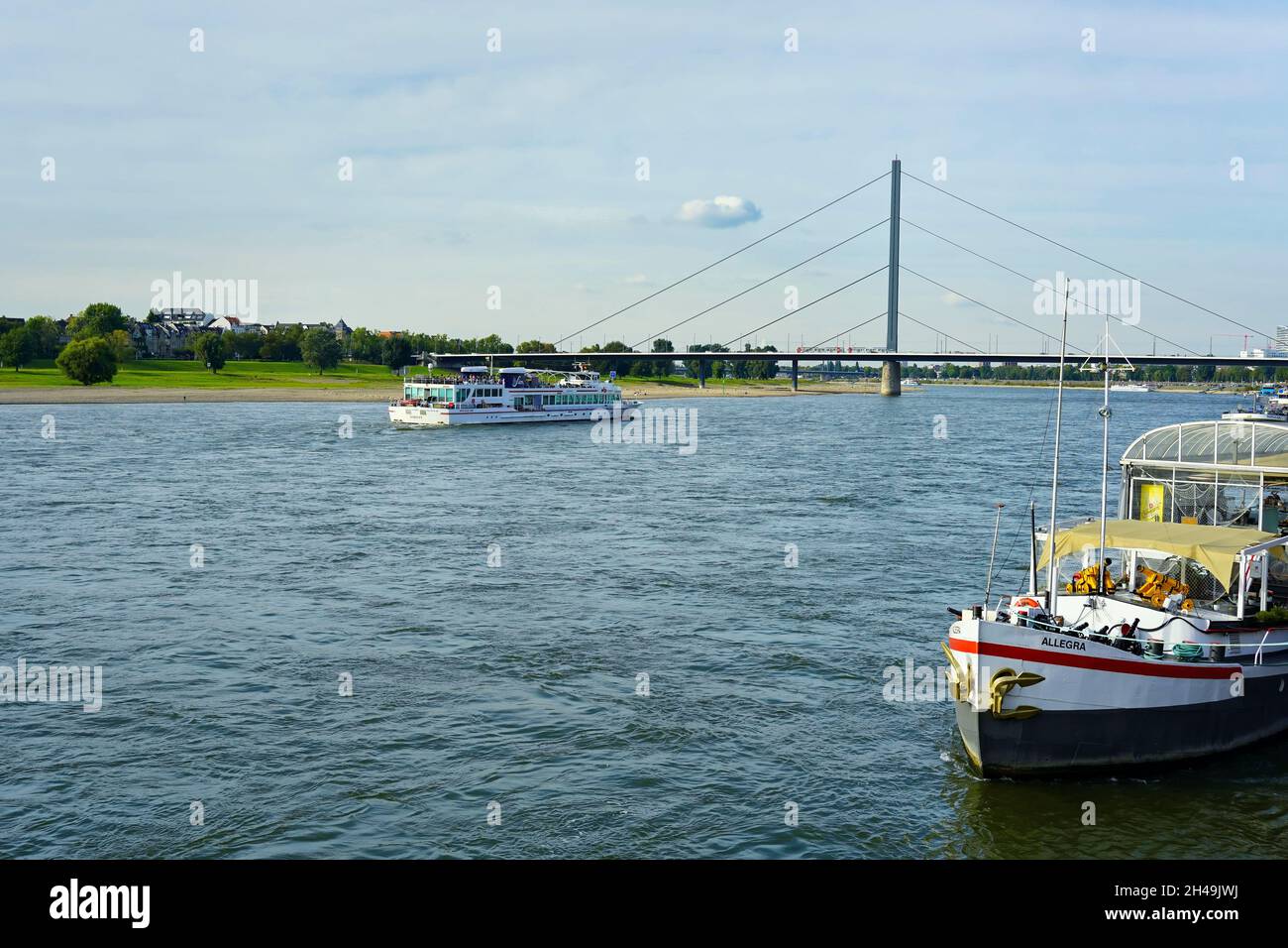 Cruise ship and restaurant ship at Rhine river in Düsseldorf, Germany. Stock Photo