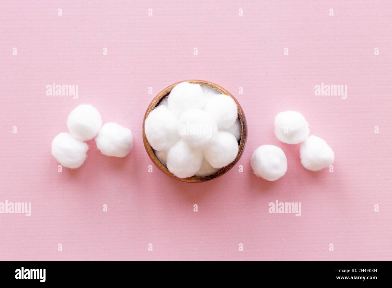 Delicate soft cotton balls in bowl. Cosmetic makeup remover supplies Stock  Photo - Alamy