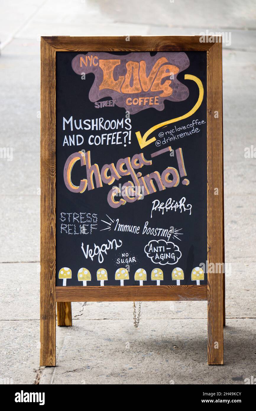 CHAGACCINO. A sign advertising a bizarre drink mix of mushrooms and coffee. Outside the NYC Love Street Coffee Shop in Astoria, Queens, New York. Stock Photo