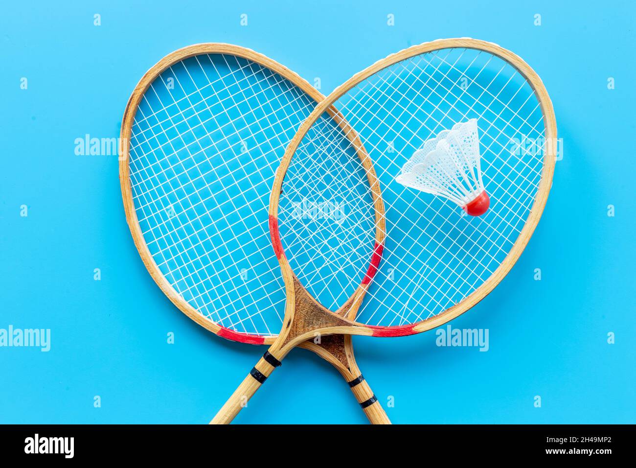 Competitive sports concept with badminton rackets and shuttlecock Stock