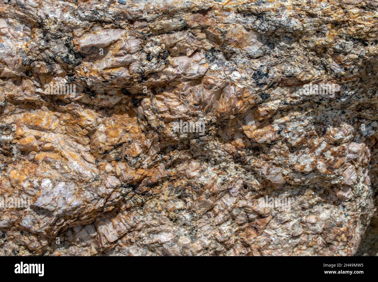 With lots of sizes, shapes, textures, lines, ridges and colors, this extremen closeup of a large rock portion of a Colorado mountain is glorious. Stock Photo