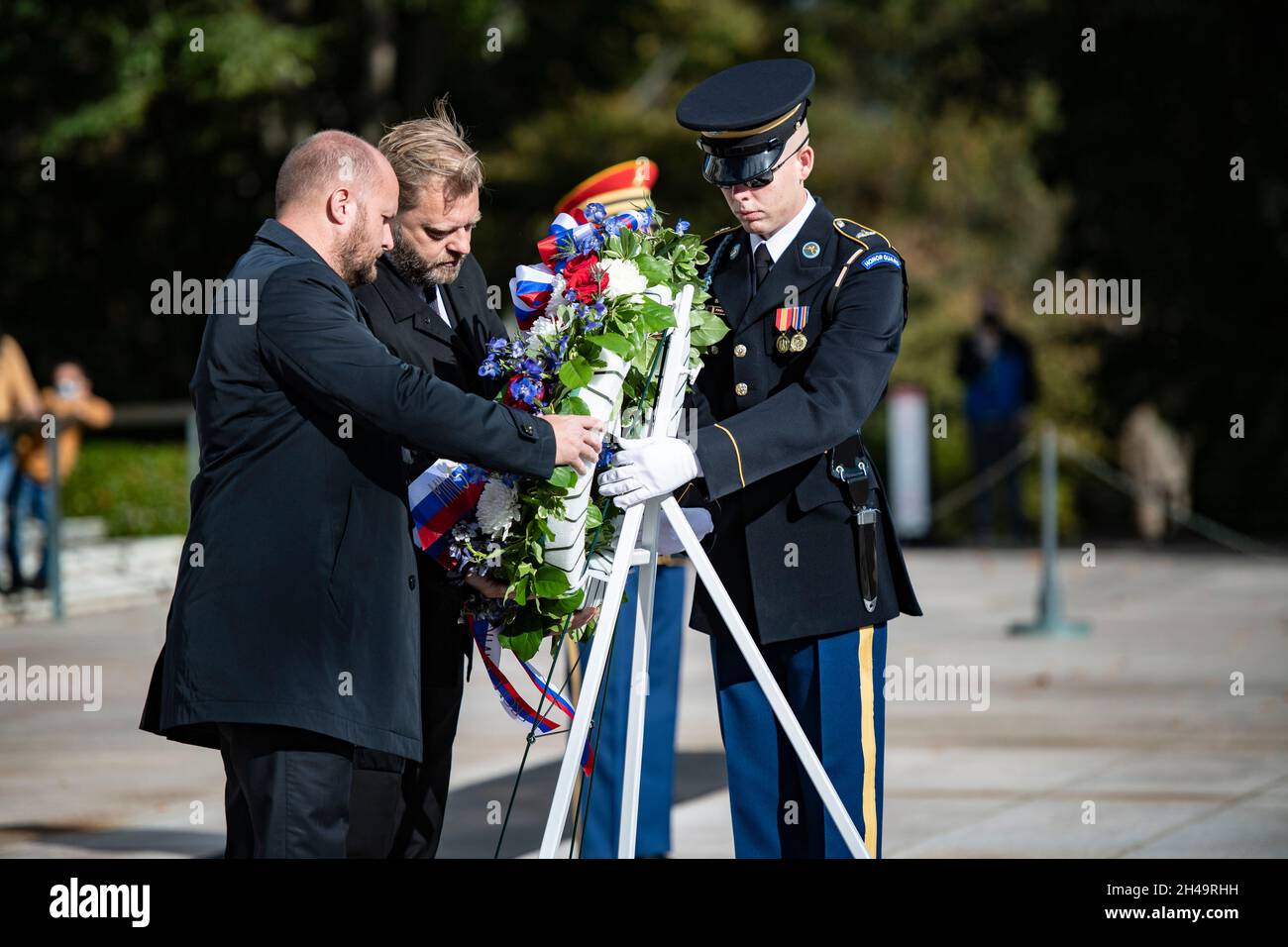 Arlington, United States of America. 26 October, 2021. Slovakian Minister of Defense Jaroslav Nad’, left, and Slovak Parliamentarian Juraj Krúpa, center, place a wreath at the Tomb of the Unknown Soldier at Arlington National Cemetery, October 26, 2021 in Arlington, Virginia. Credit: Elizabeth Fraser/DOD/Alamy Live News Stock Photo
