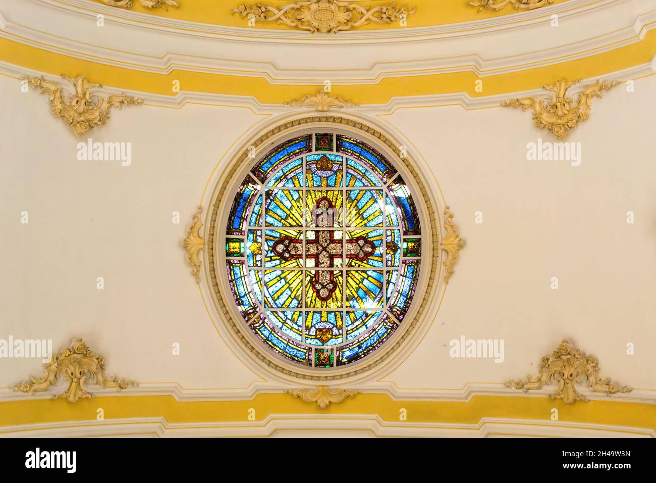 Stained glass skylight in the interior architecture of the Church of Santa Cruz dos Militares in Rio de Janeiro, Brazil. The old catholic temple is a Stock Photo