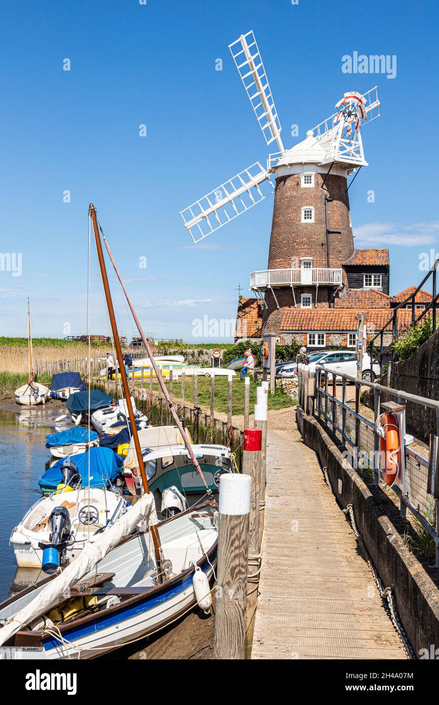 The early 19th century Cley Windmill beside the River Glaven in the village of Cley next the Sea, Norfolk UK Stock Photo