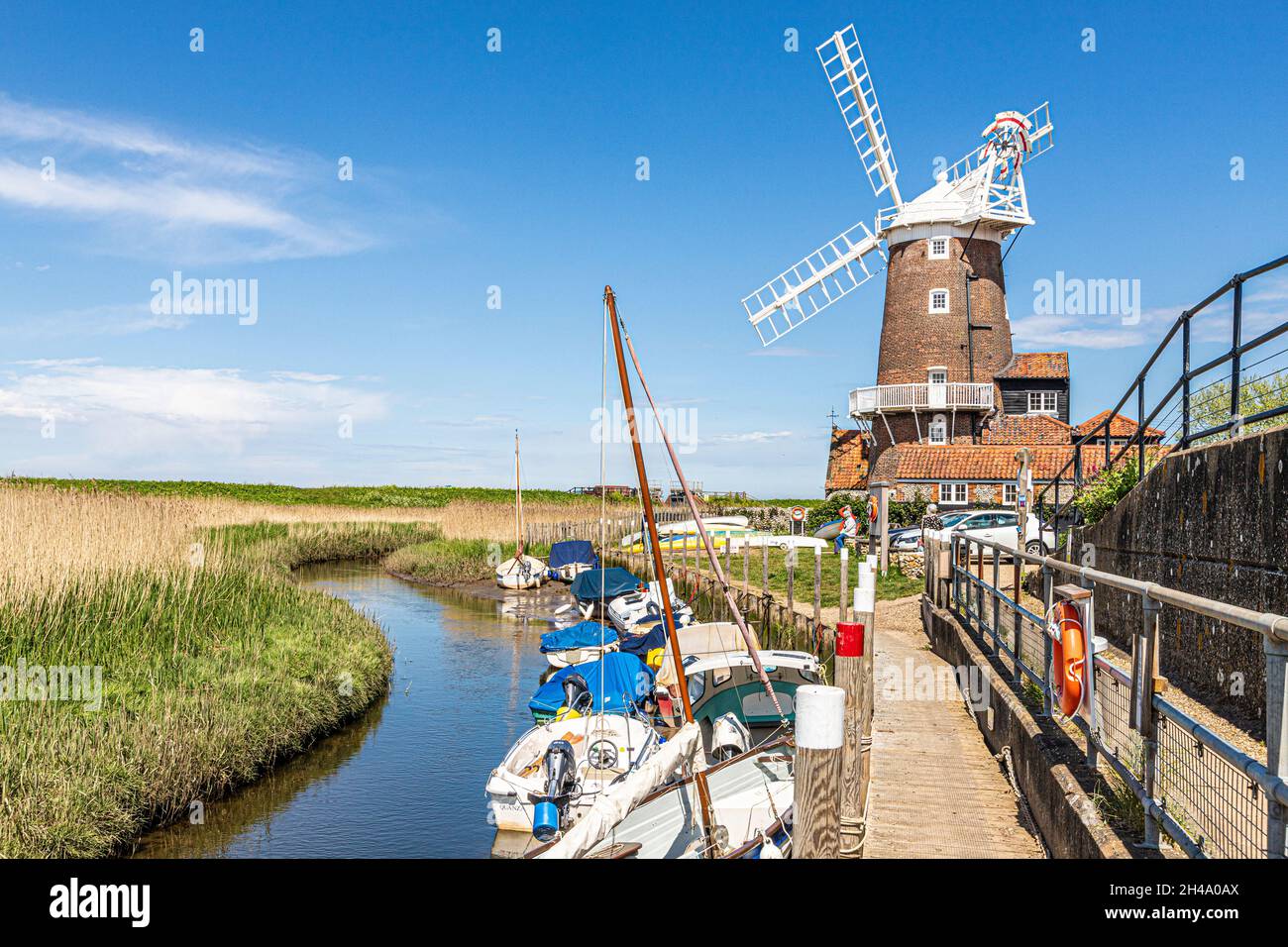 The early 19th century Cley Windmill beside the River Glaven in the village of Cley next the Sea, Norfolk UK Stock Photo