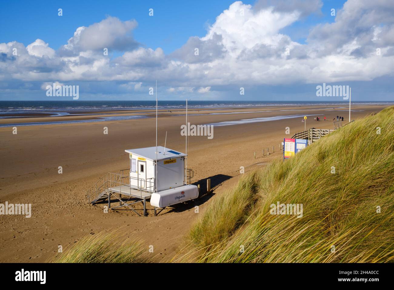 Lifeguards hut in front of sand dunes on a windy autumn day Stock Photo