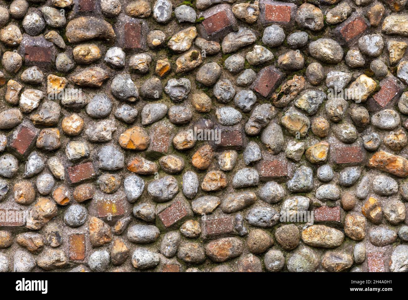 flint stones in cement or pebble dashed wall in the style of west and east sussex Arhchitecture and building in the traditional style. Stock Photo
