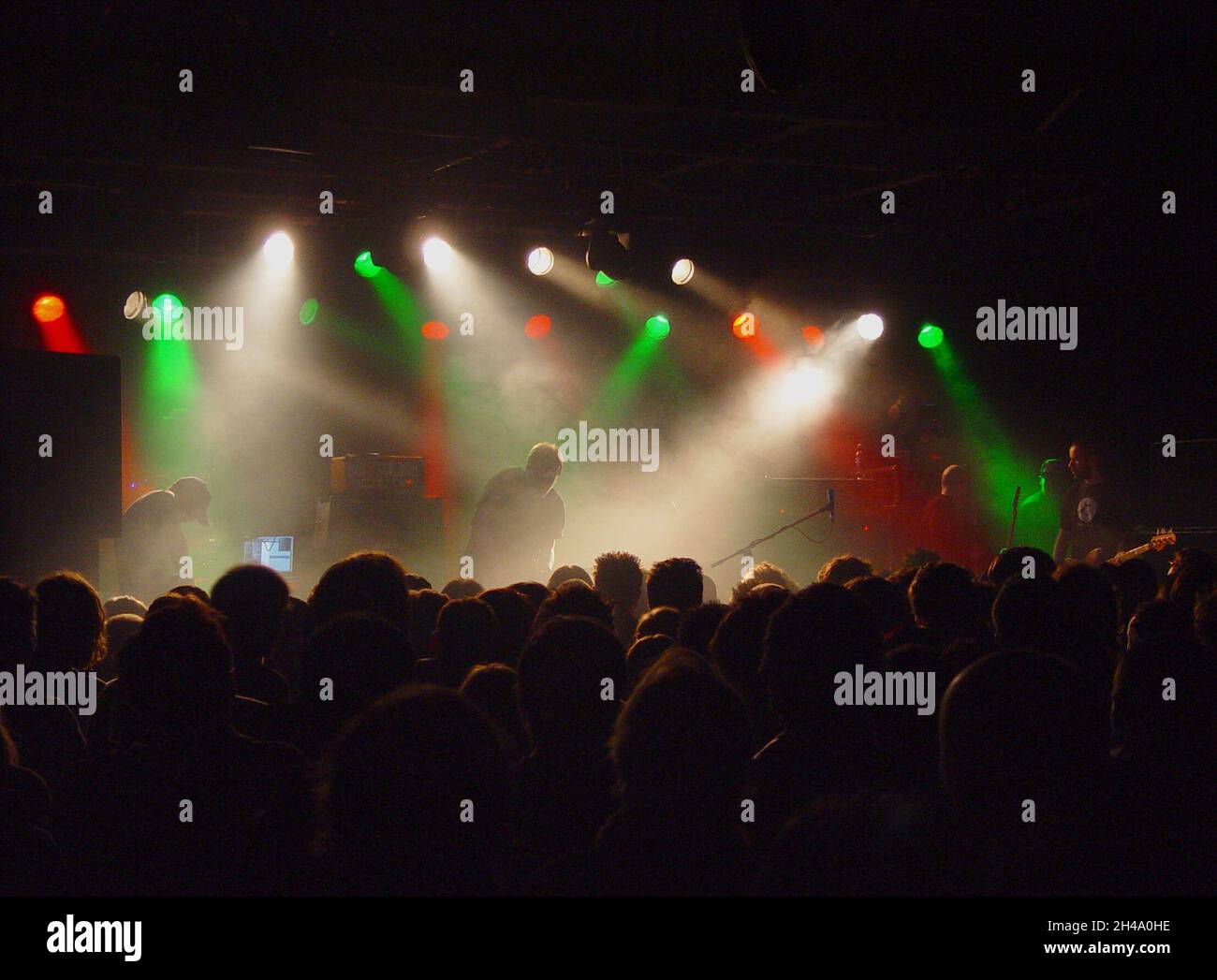 Scottish indie band Mogwai, photographed on stage at Nottingham Rock City in April 2004. Moody concert lighting. Stock Photo