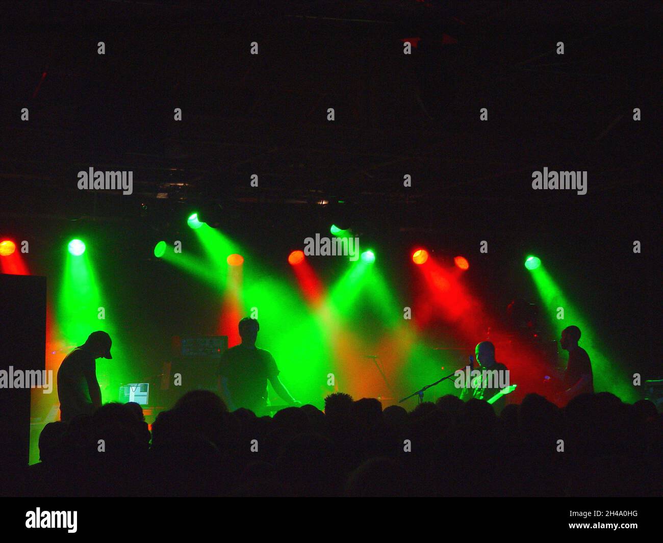 Scottish indie band Mogwai, photographed on stage at Nottingham Rock City in April 2004. Moody concert lighting. Stock Photo