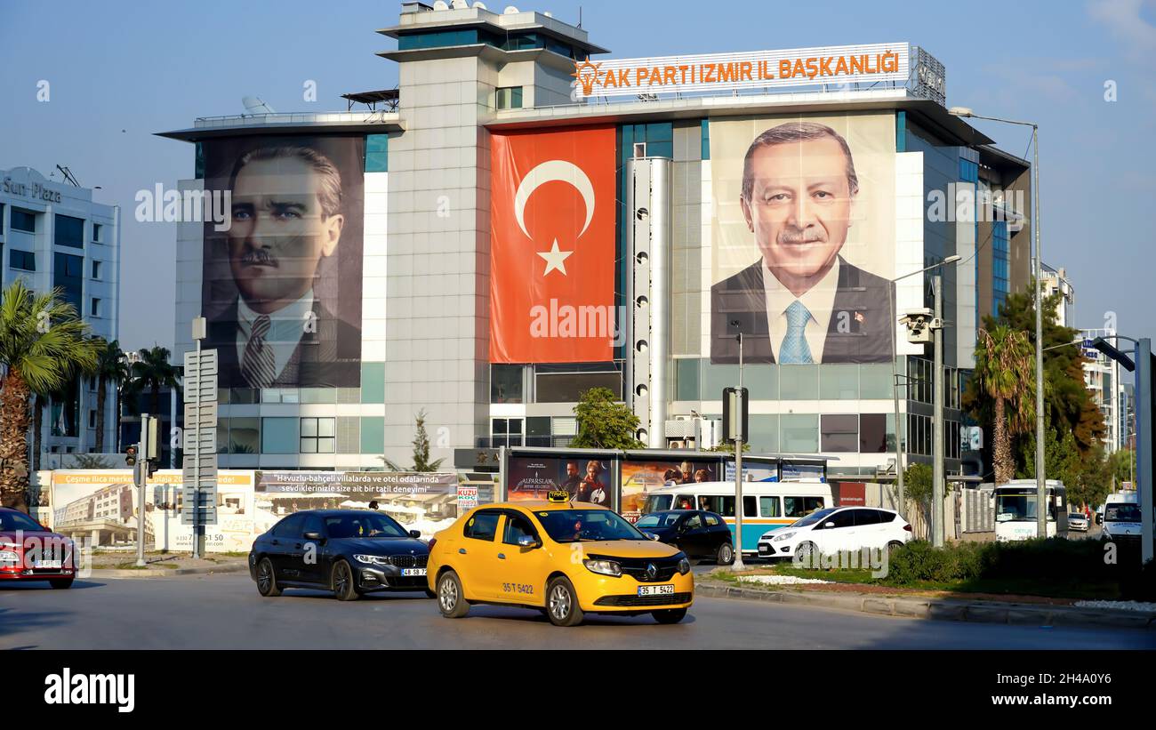An exterior view of AK Party Izmir Provincial Directorate; The big poster of Turkey's president Recep Tayyip Erdogan, The Turkish flag and  the poster of Ataturk are hanged on the exterior of the building on October 30, 2021 in Bayraklı, Izmir, Turkey. Stock Photo
