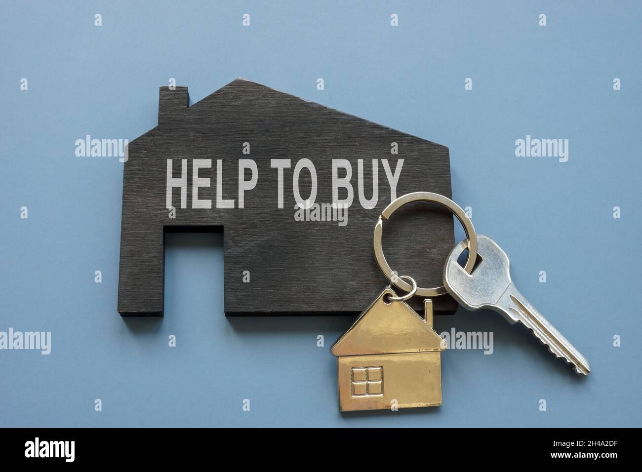 Home with phrase help to buy and real estate key. Stock Photo