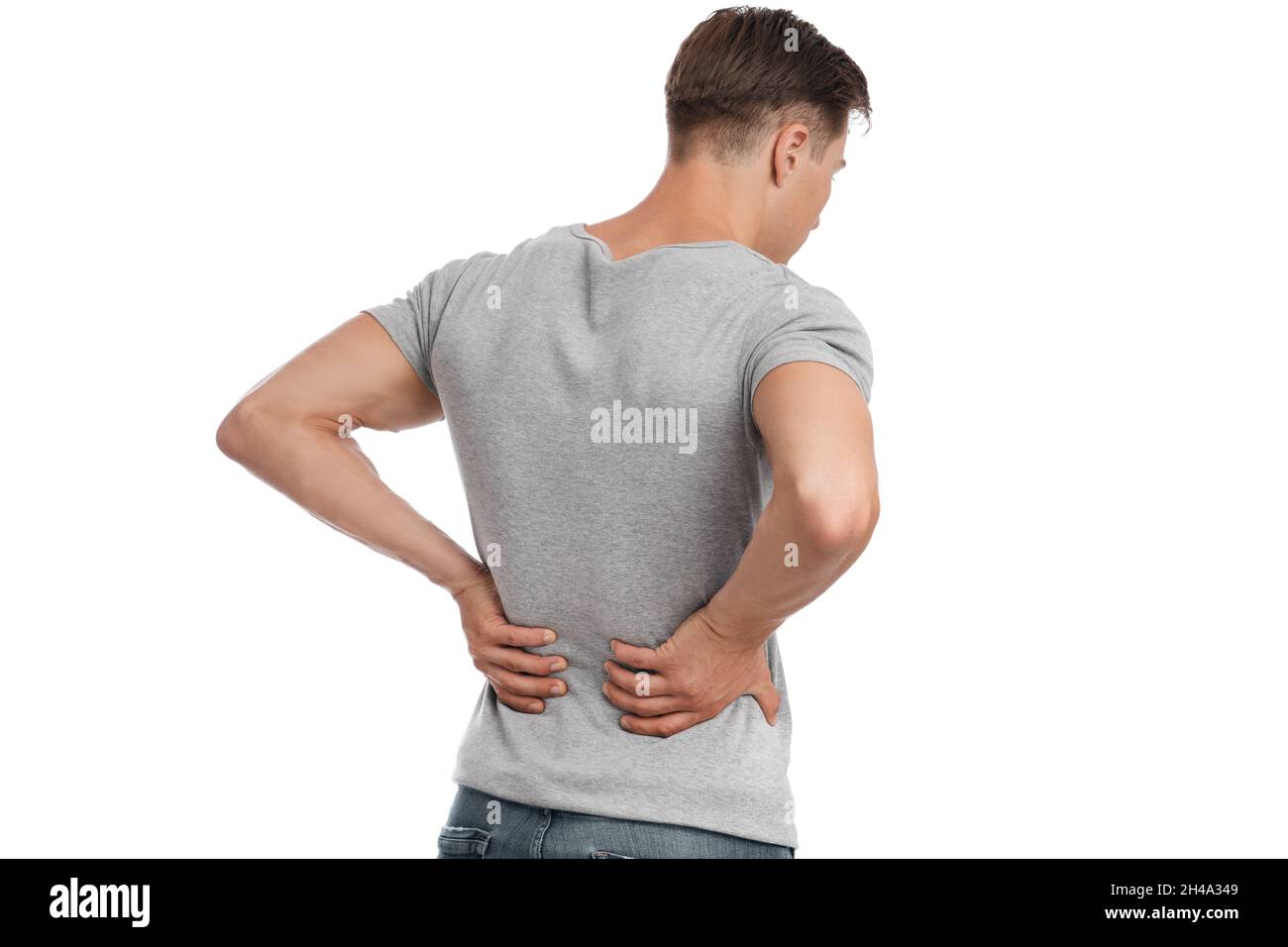 Man suffering from flank pain on white background Stock Photo - Alamy