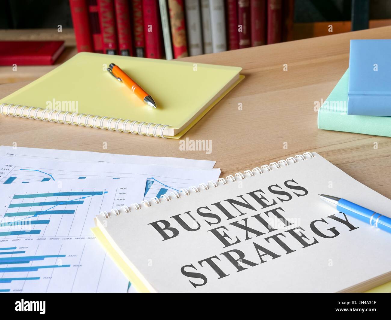 Business exit strategy papers on the desk. Stock Photo