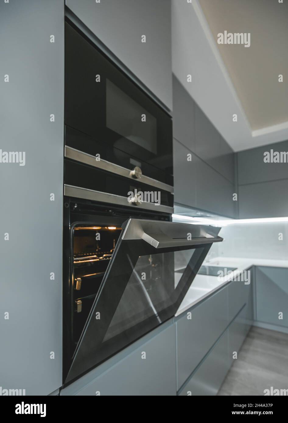 Modern furniture in the kitchen oven and microwave are built into the furniture Stock Photo