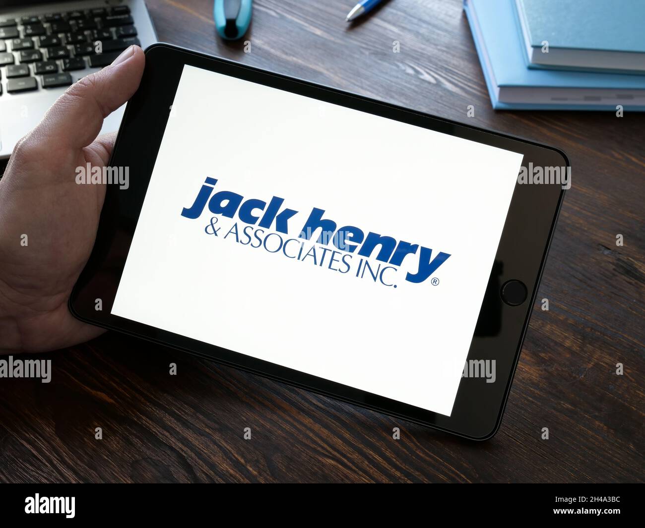 KYIV, UKRAINE - October 20, 2021. Jack Henry and Associates logo on the tablet. Stock Photo