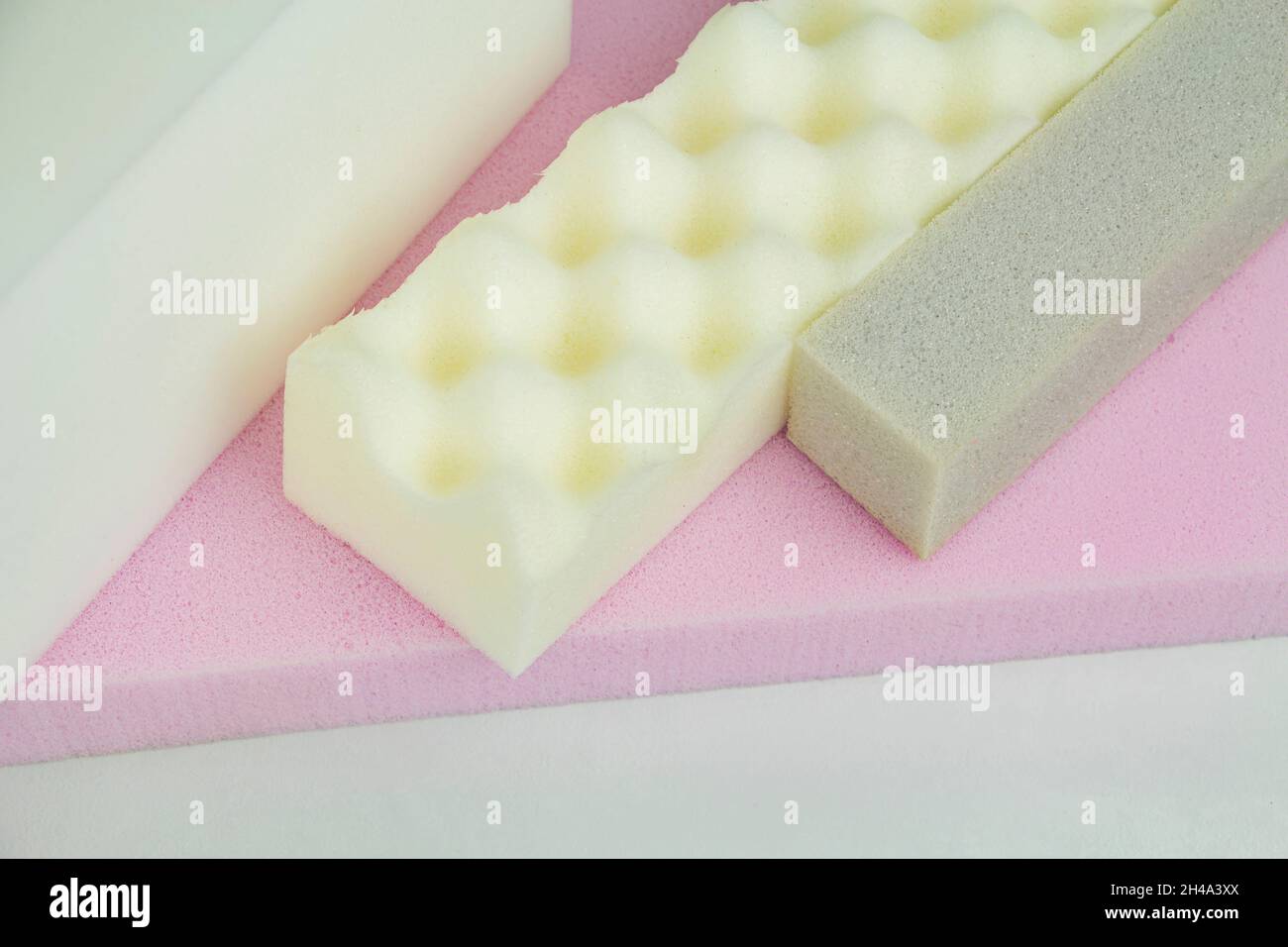 a piece of foam rubber of different sizes and colors, production of upholstered furniture Stock