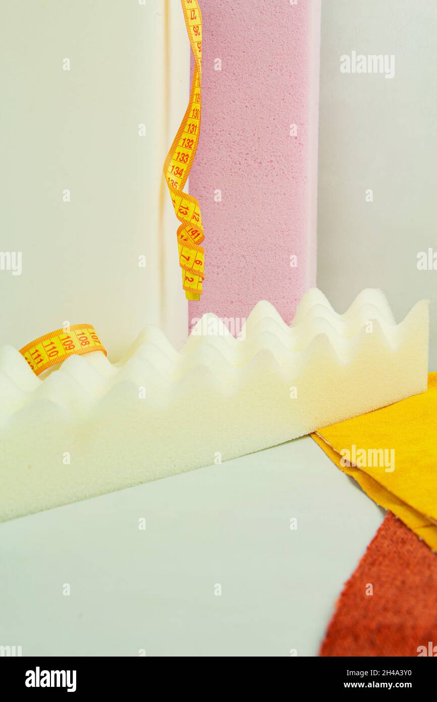 a piece of foam rubber of different sizes and colors, production of upholstered furniture Stock