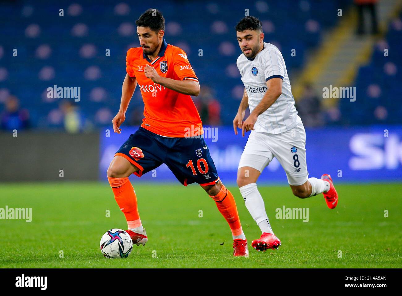 ISTANBUL, TURKEY - NOVEMBER 1: Berkay Ozcan of Istanbul Basaksehir FK,  Sinan Kurt of Adana Demirspor during the Super Lig match between Istanbul  Basaksehir and Adana Demirspor at Basaksehir Fatih Terim Stadium